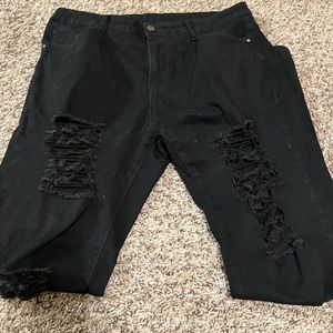 black cut up jeans